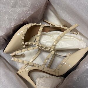 Valentino Garavani Rockstud Patent Leather Pointed-Toe Pumps in Nude Beige